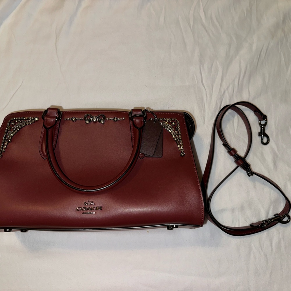 Coach jeweled satchel wine colored with bronze crystals